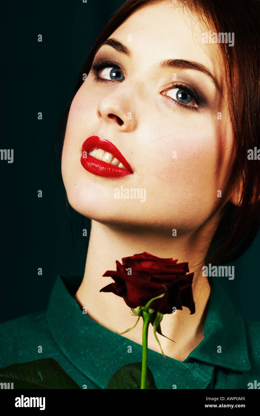 Young woman with red rose Stock Photo