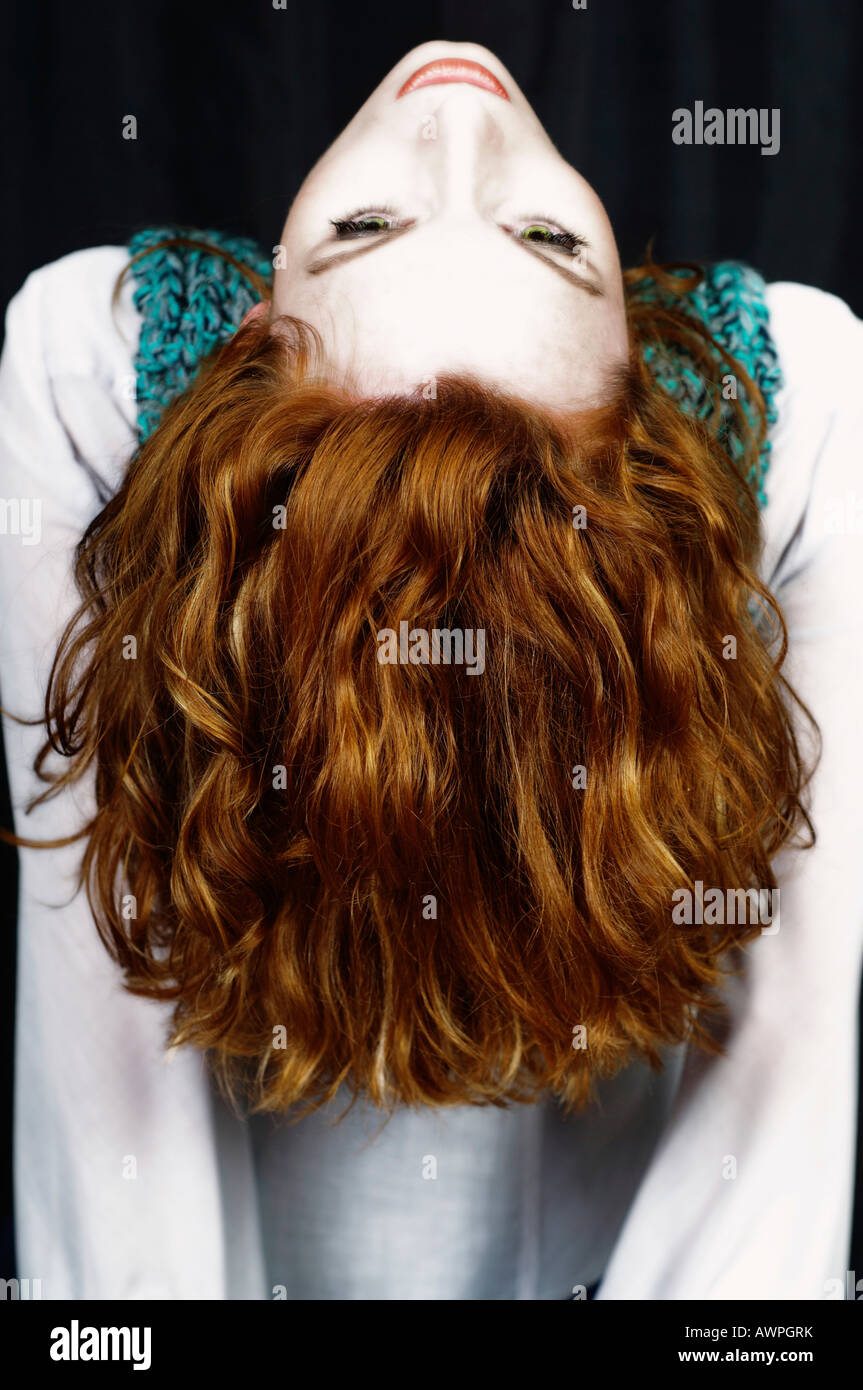 Young woman with long red hair Stock Photo - Alamy