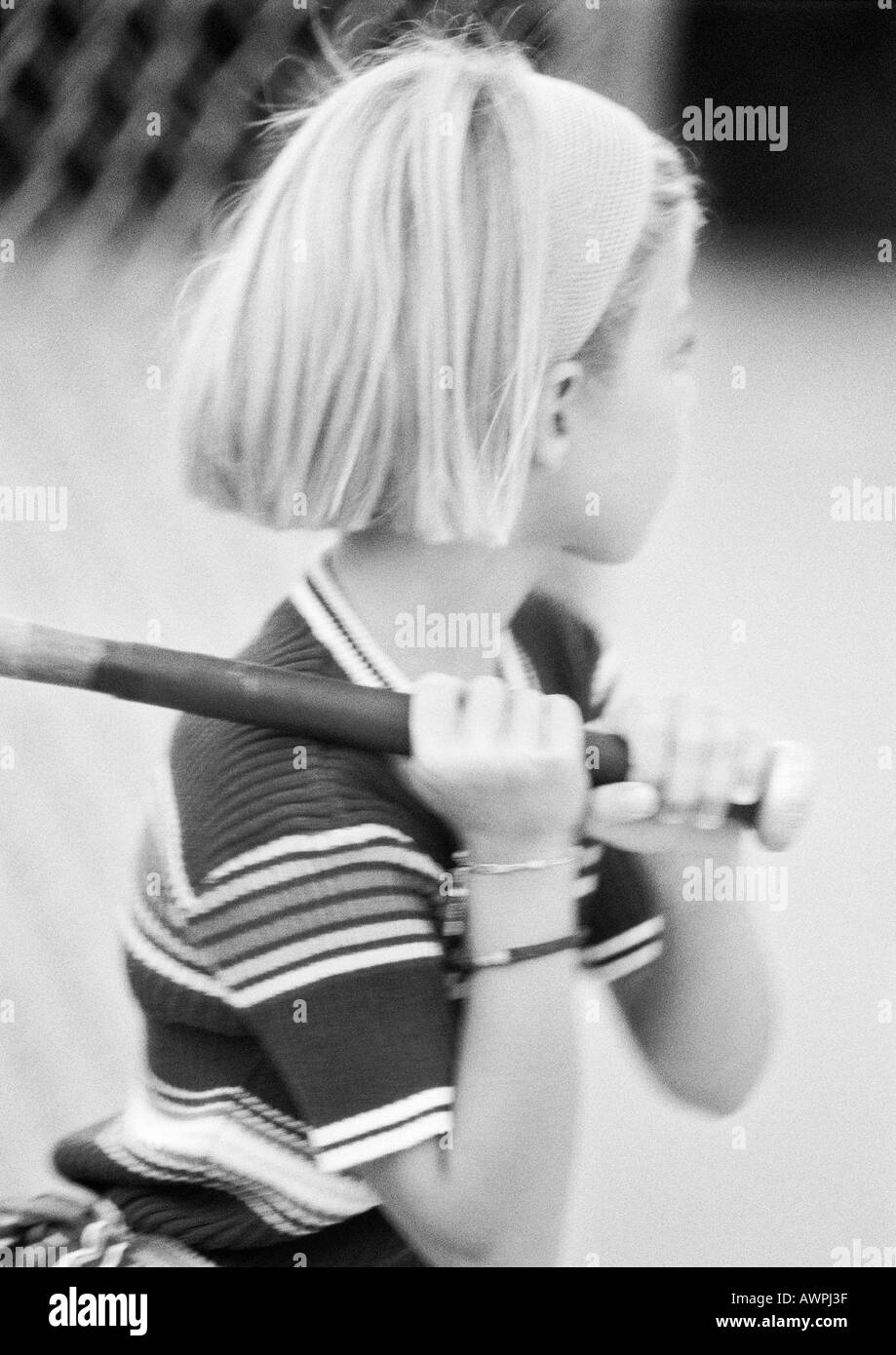 Girl holding baseball bat, b&w Stock Photo