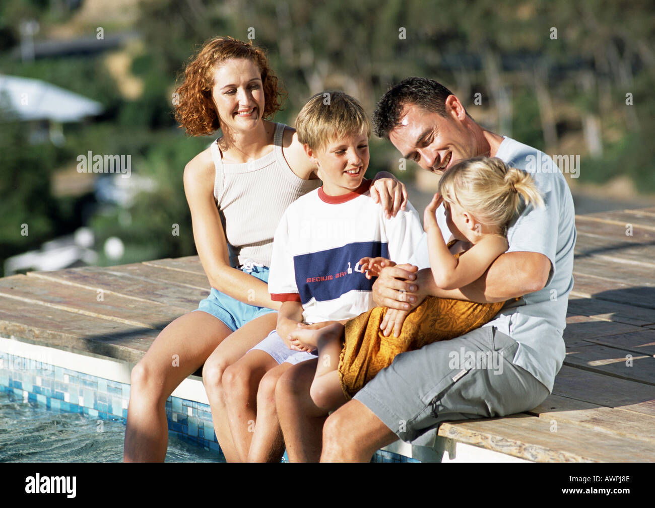 Hugging Family Pool Mother daughter hugging swimming pool hi-res stock photography and ...