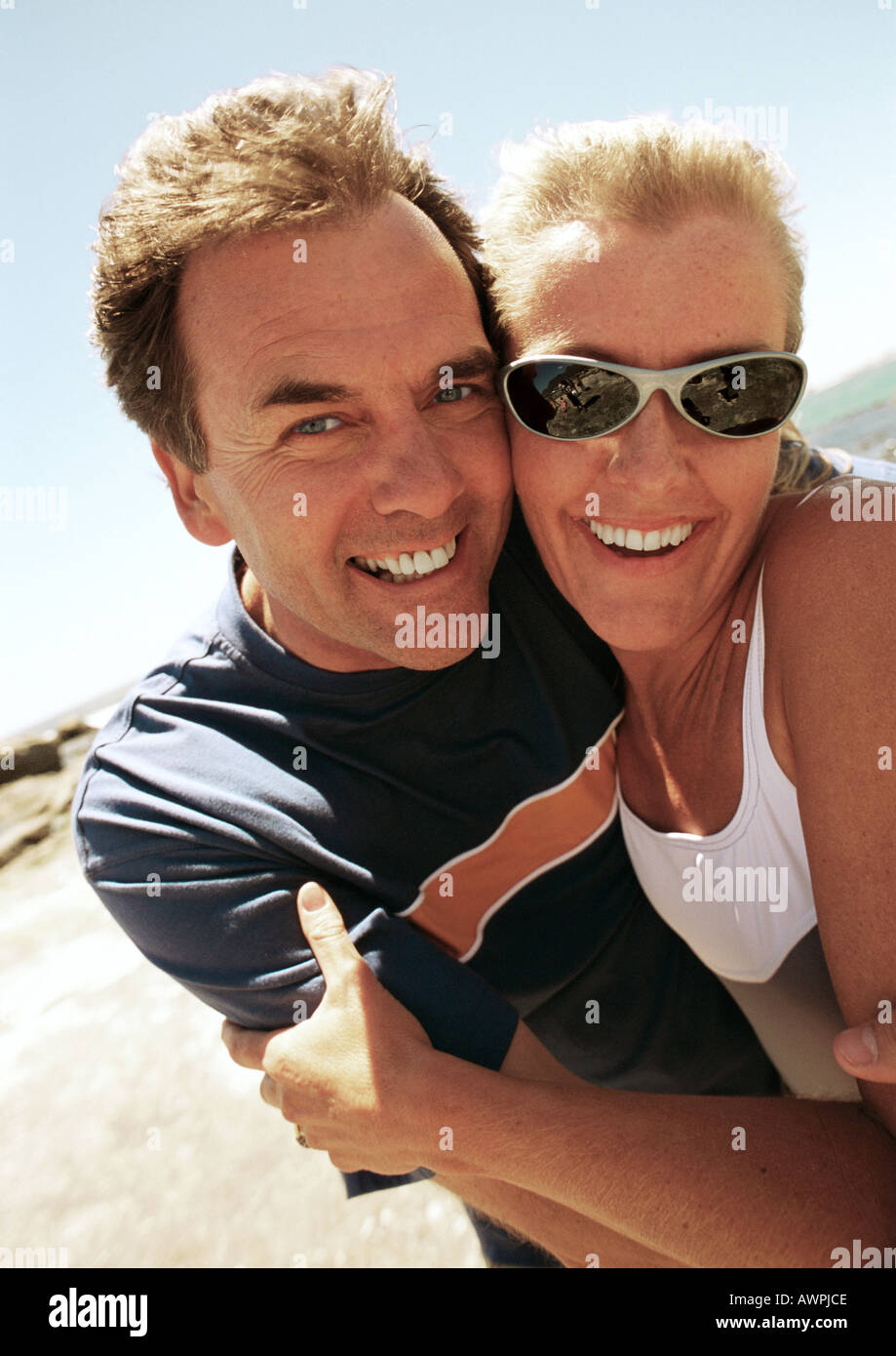 Close-up of man and woman hugging at the beach Stock Photo - Alamy
