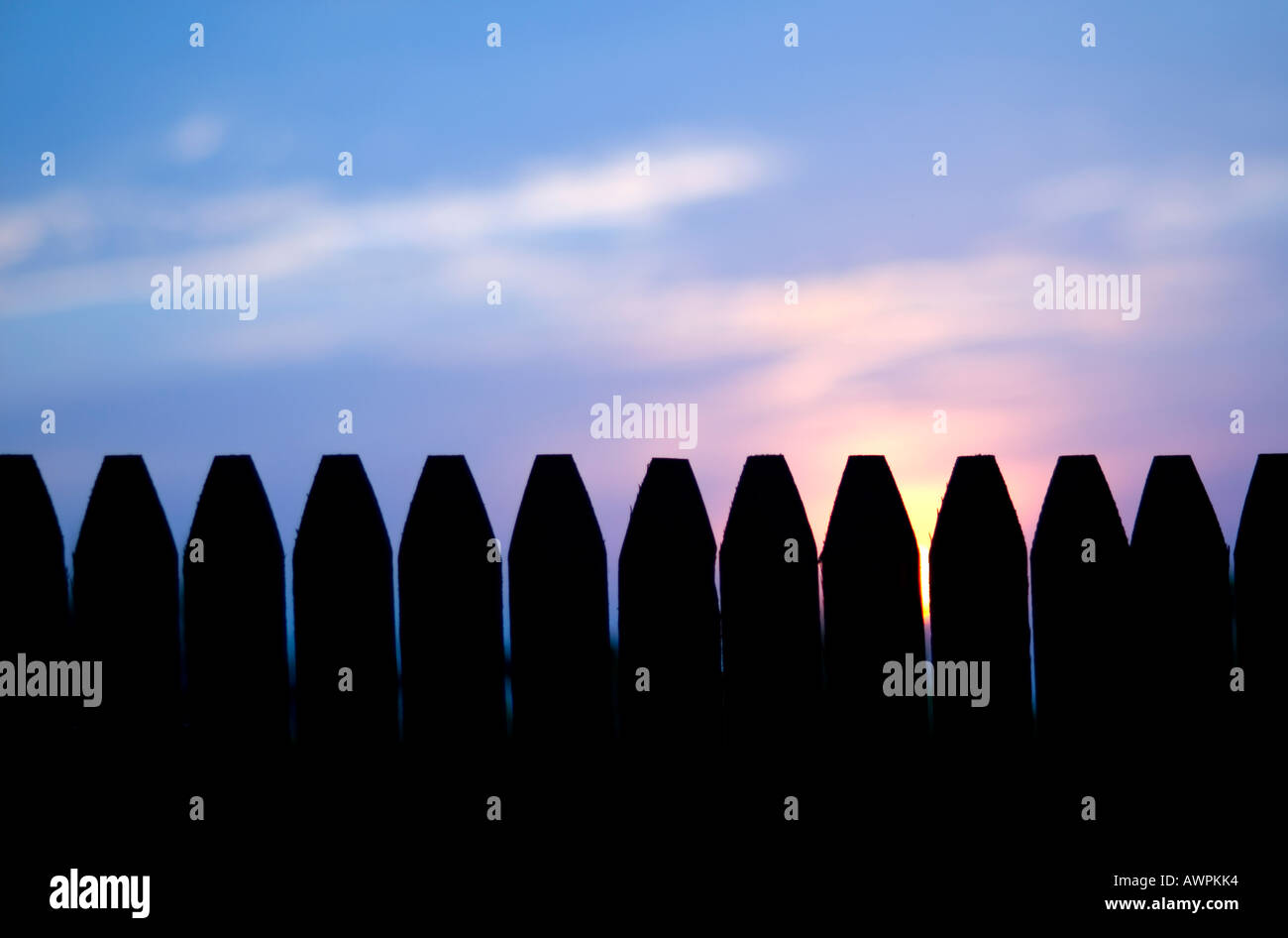 sunset over picket fence Stock Photo Alamy