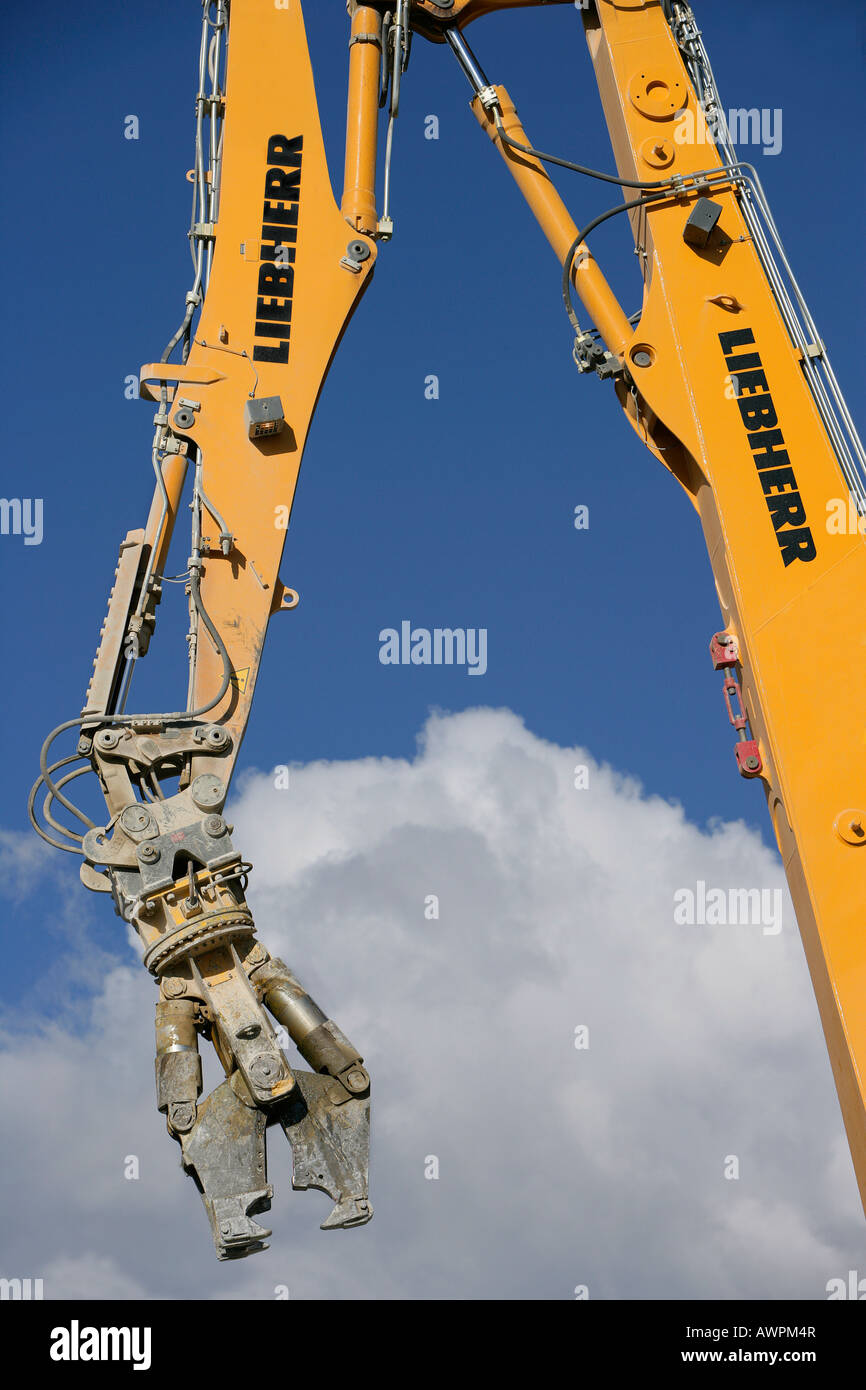 Excavator outfitted for demolition work Stock Photo