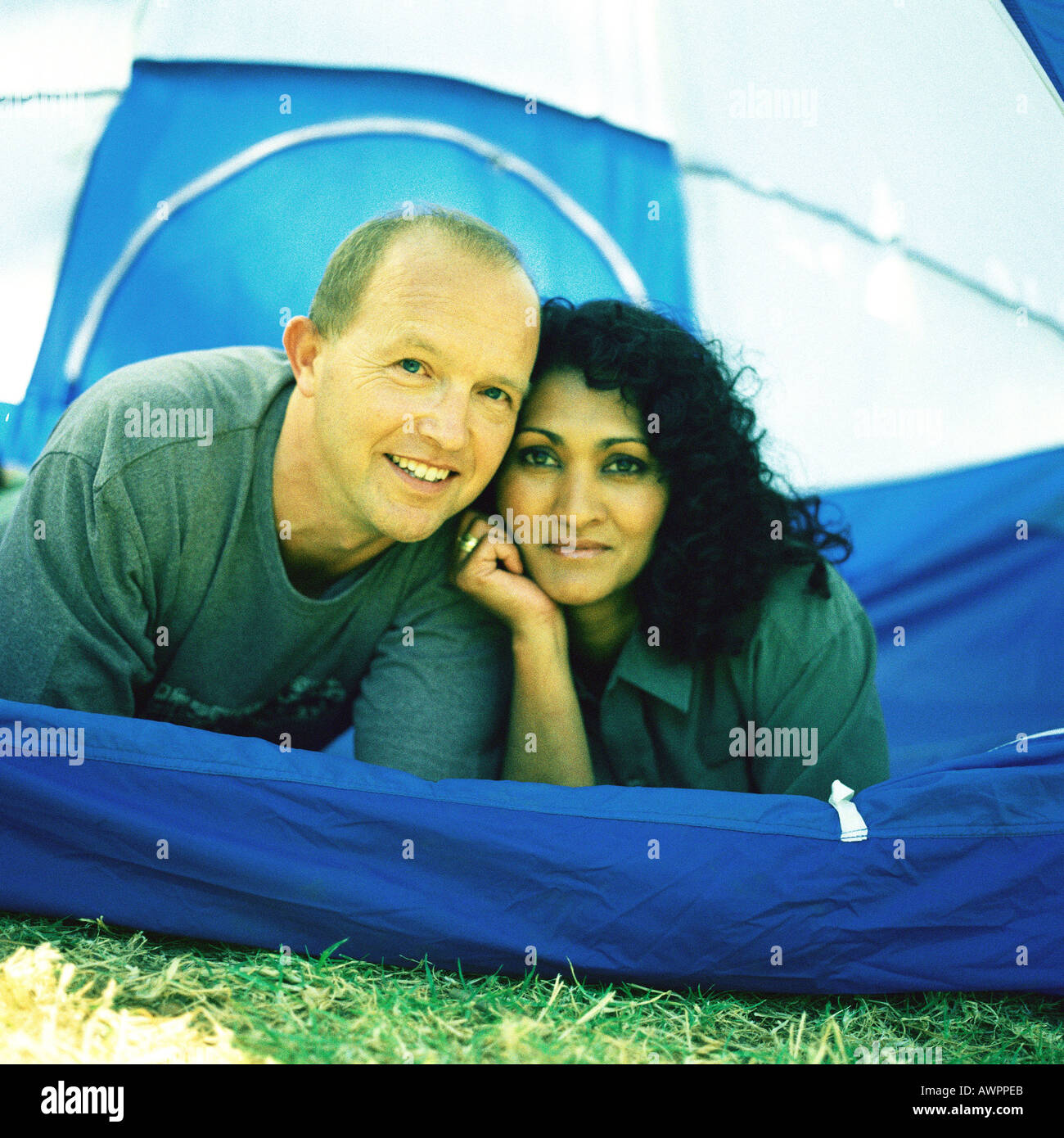Couple lying tent, portrait Stock Photo