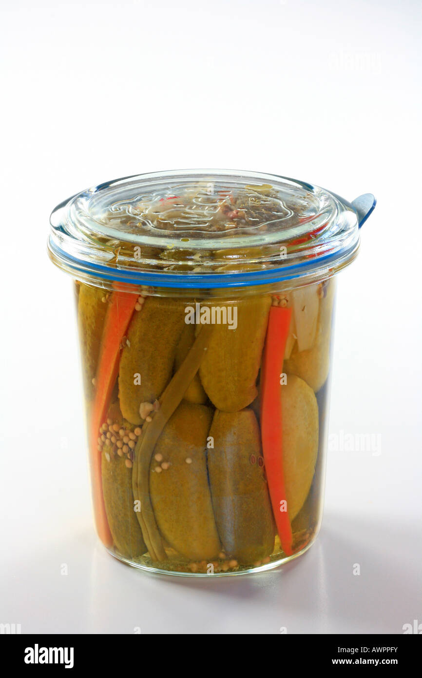 Jar of pickles in a mason jar, pickled cucumbers, carrots and beans Stock Photo