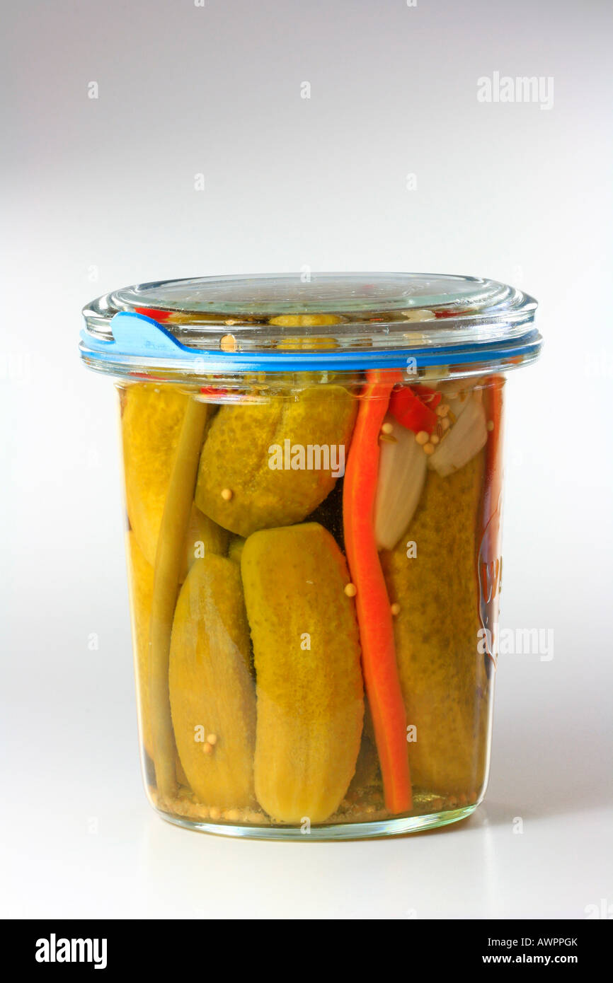 Jar of pickles in a mason jar, pickled cucumbers, carrots and beans Stock Photo