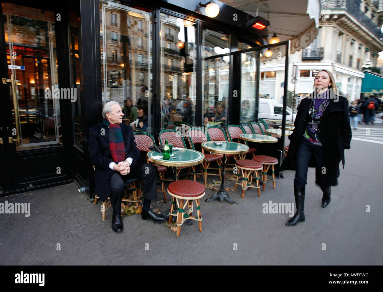 Man watching a woman as she walks by Cafe de Flore, Quartier Saint-Germain-des-Pres, Paris, France, Europe Stock Photo