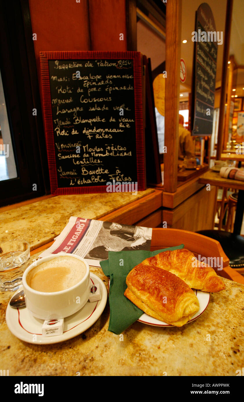 'Le petit dejeuner, ' café au lait and croissants for breakfast at Patisserie Reglait, Quartier Latin, Paris, France, Europe Stock Photo