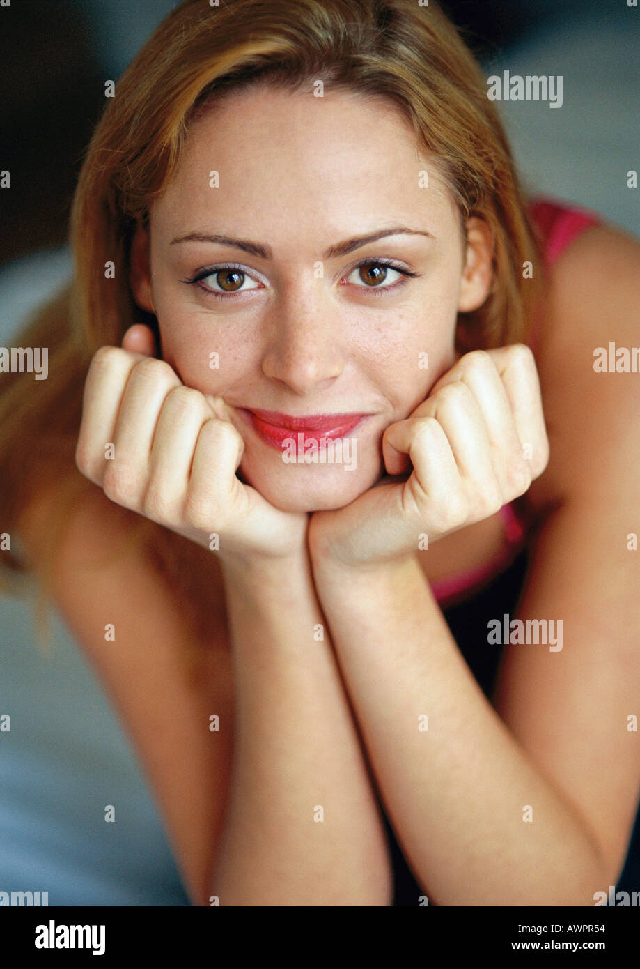 Woman leaning on elbows, portrait Stock Photo Alamy