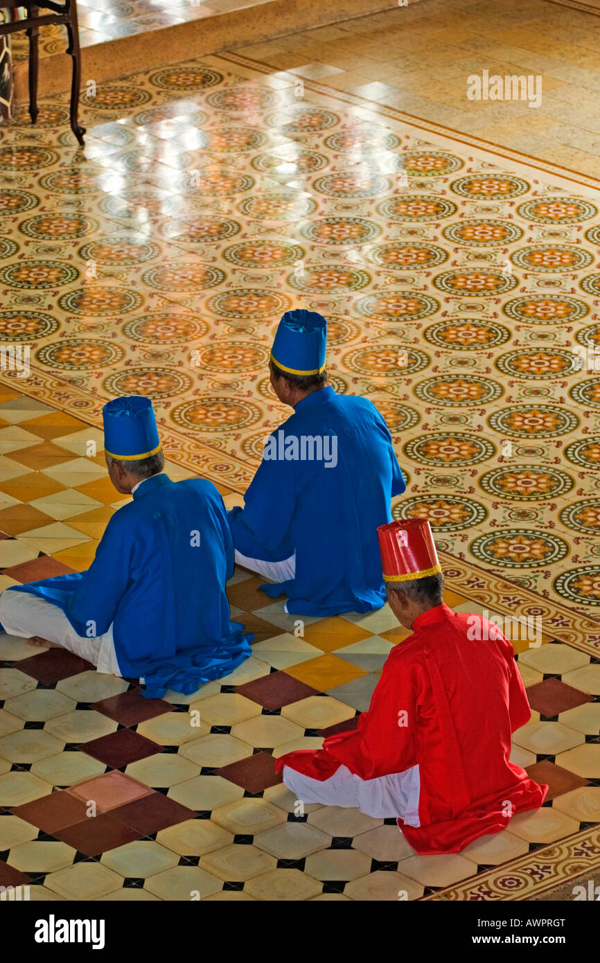 Praying members of the sect Cao Dai, Tay Ninh, Vietnam, Asia Stock Photo
