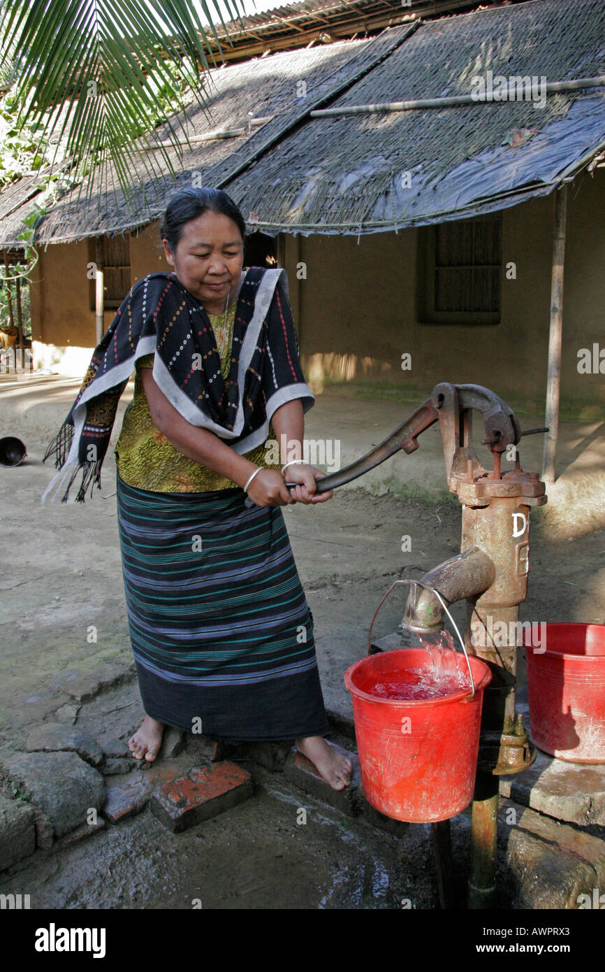 BANGLADESH Woman of the Garo tribal minority getting water from her hand pump Stock Photo Alamy
