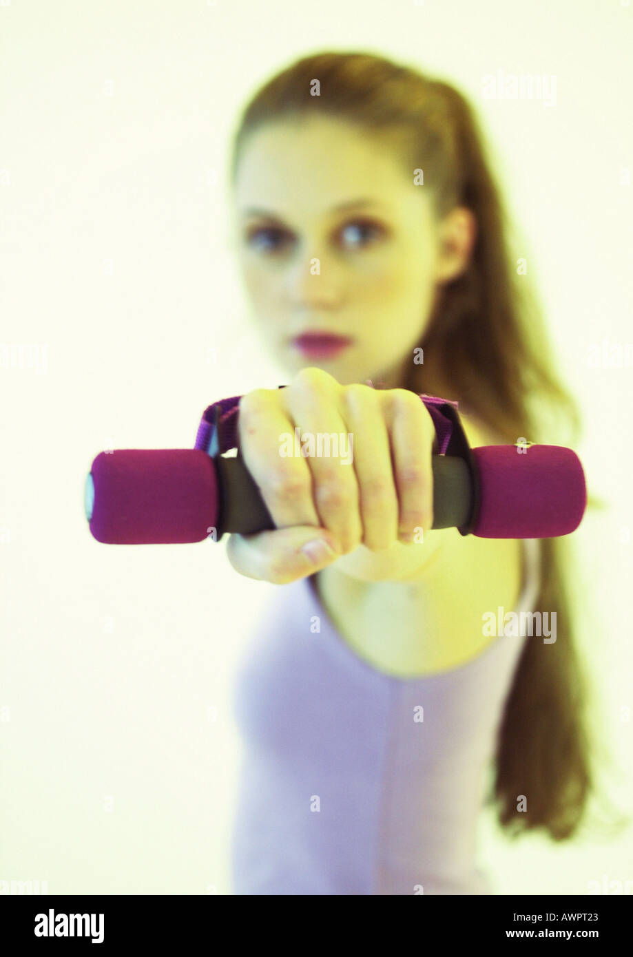 Woman lifting weights Stock Photo