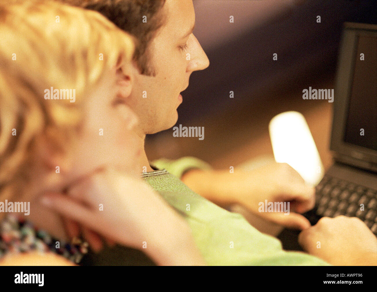 Couple using laptop, close-up Stock Photo