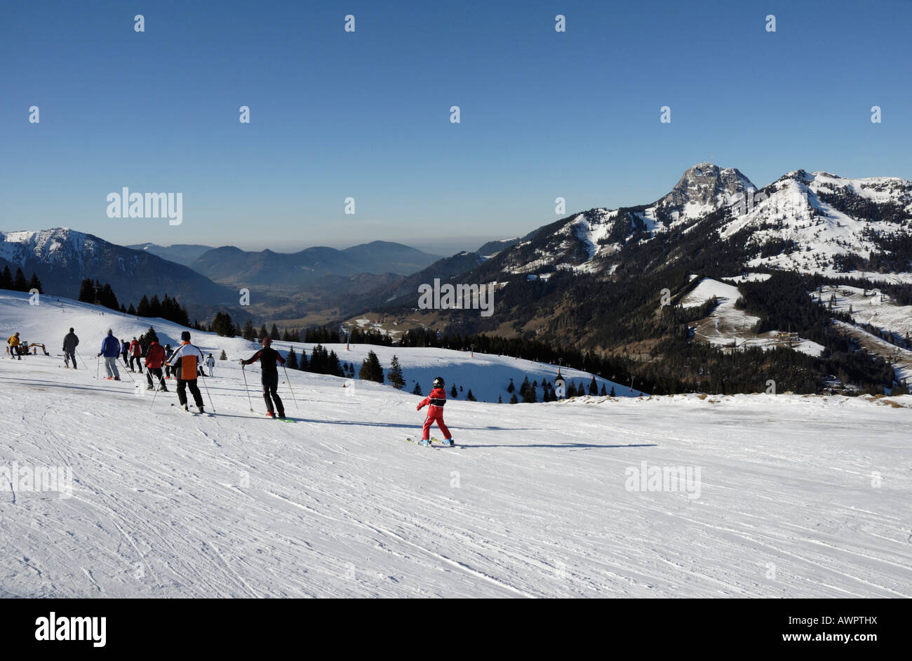Skiers at Sudelfeld Ski Resort, Wendelstein Massif in the background ...