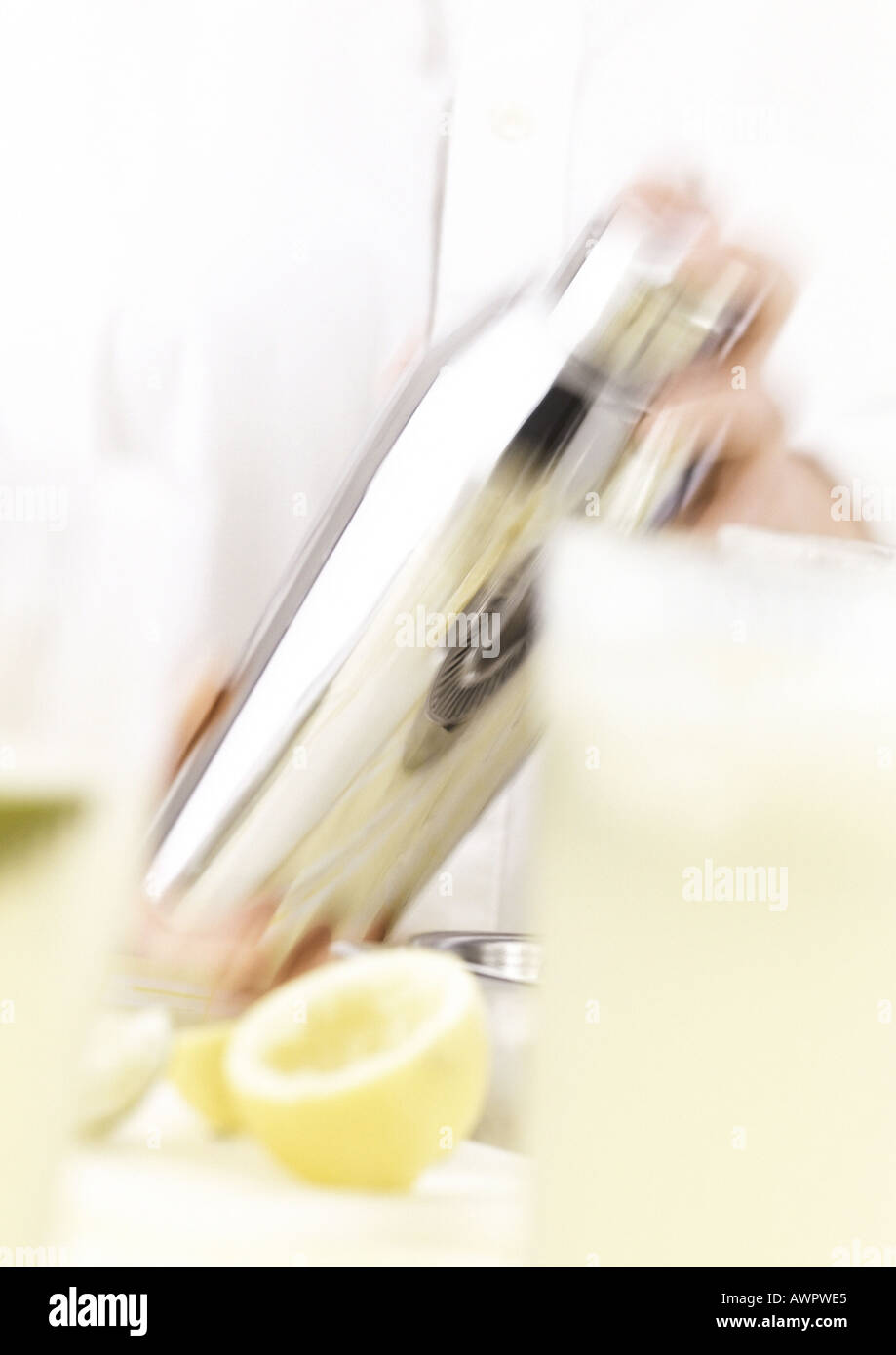 Hands shaking cocktail shaker, blurred motion Stock Photo Alamy
