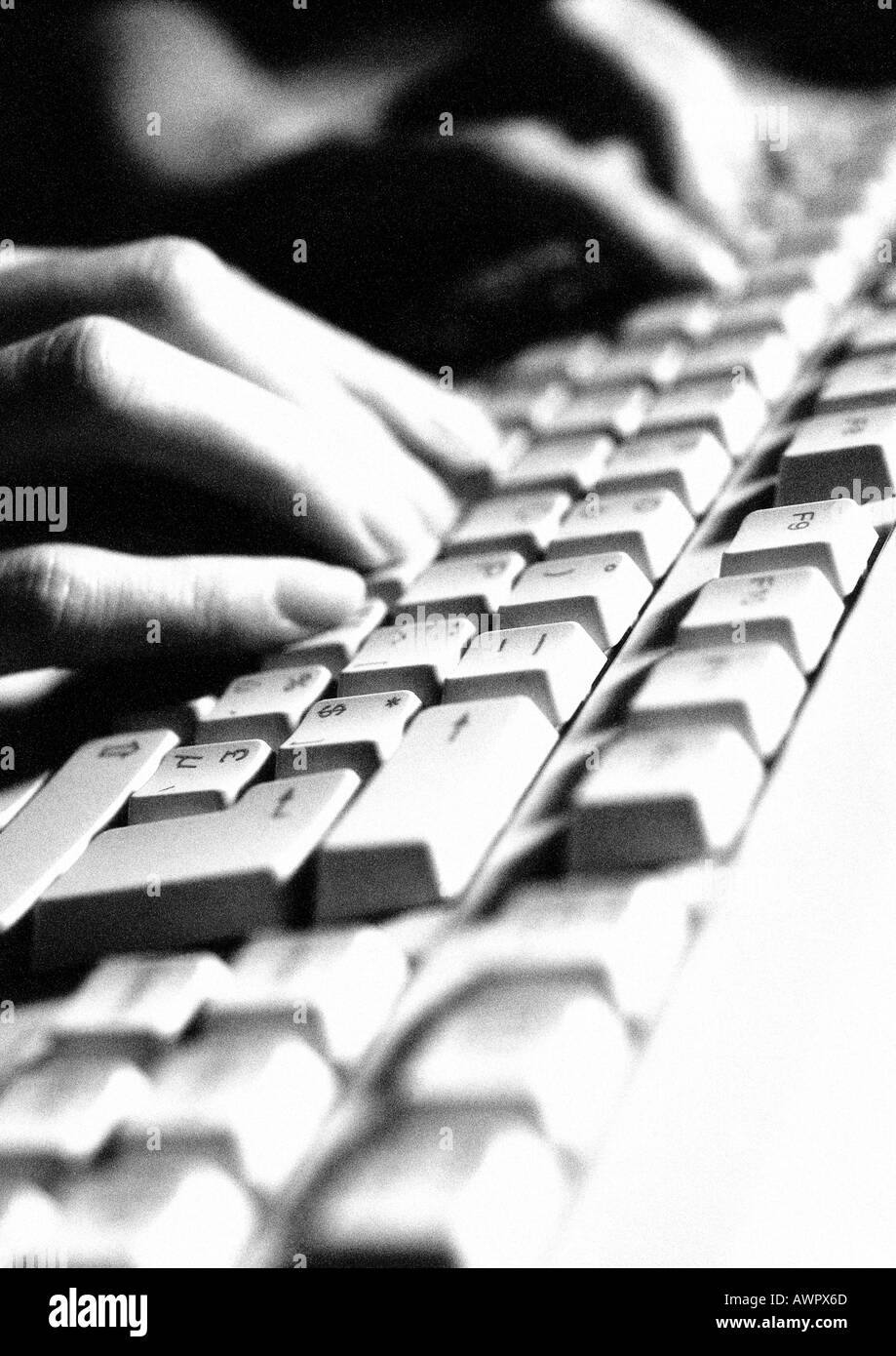 Hands on computer keyboard, close-up Stock Photo