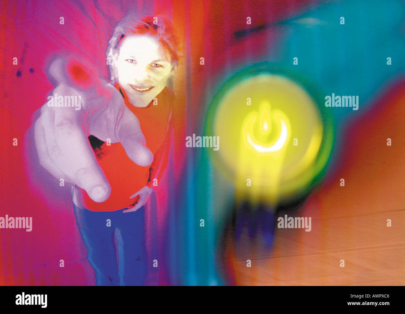 Young man smiling, pointing toward camera, digital composite. Stock Photo