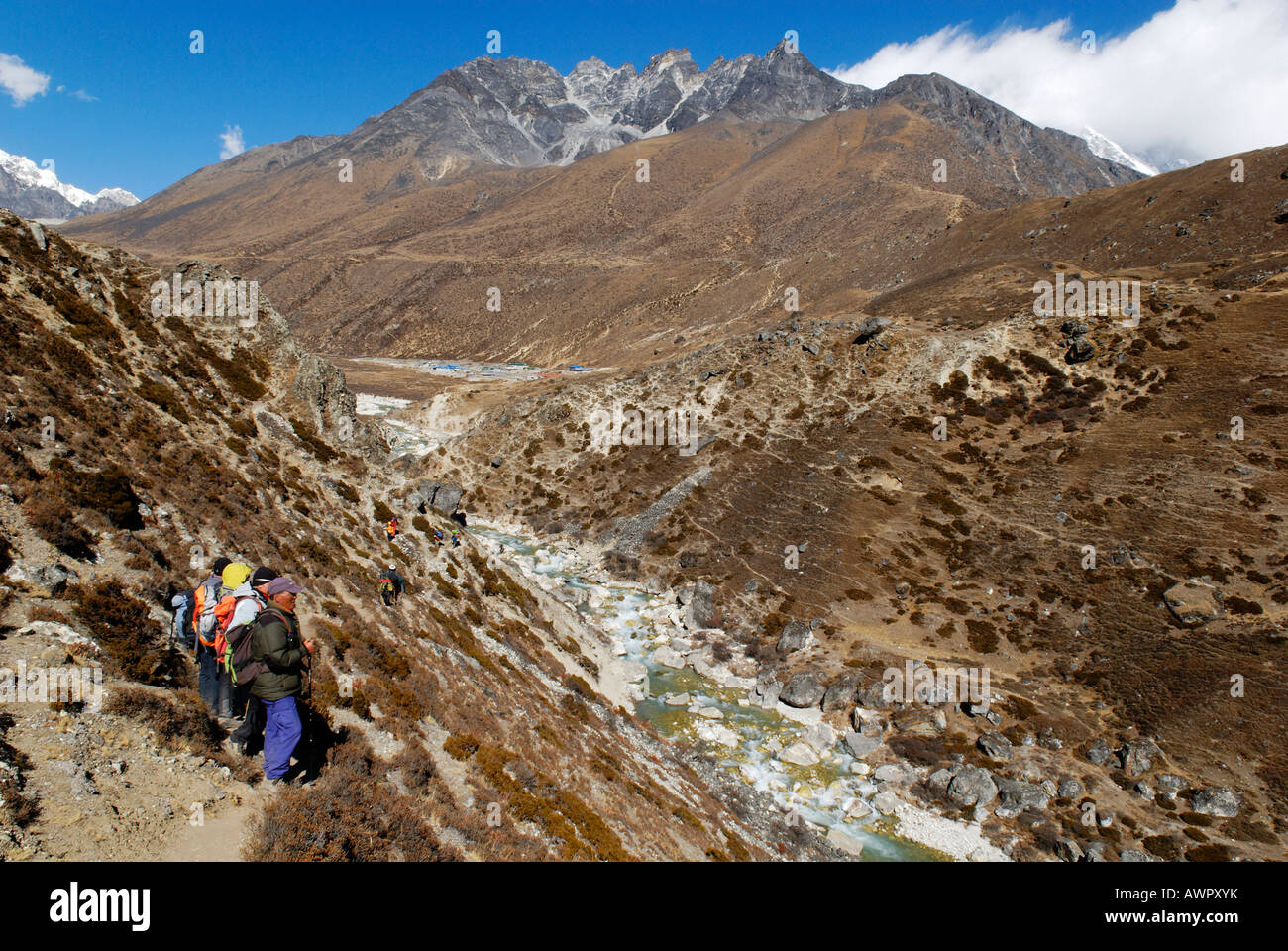 Trekking group at Lobuche Khola valley with Pokalde (5806), Sagarmatha National Park, Khumbu Himal, Nepal Stock Photo