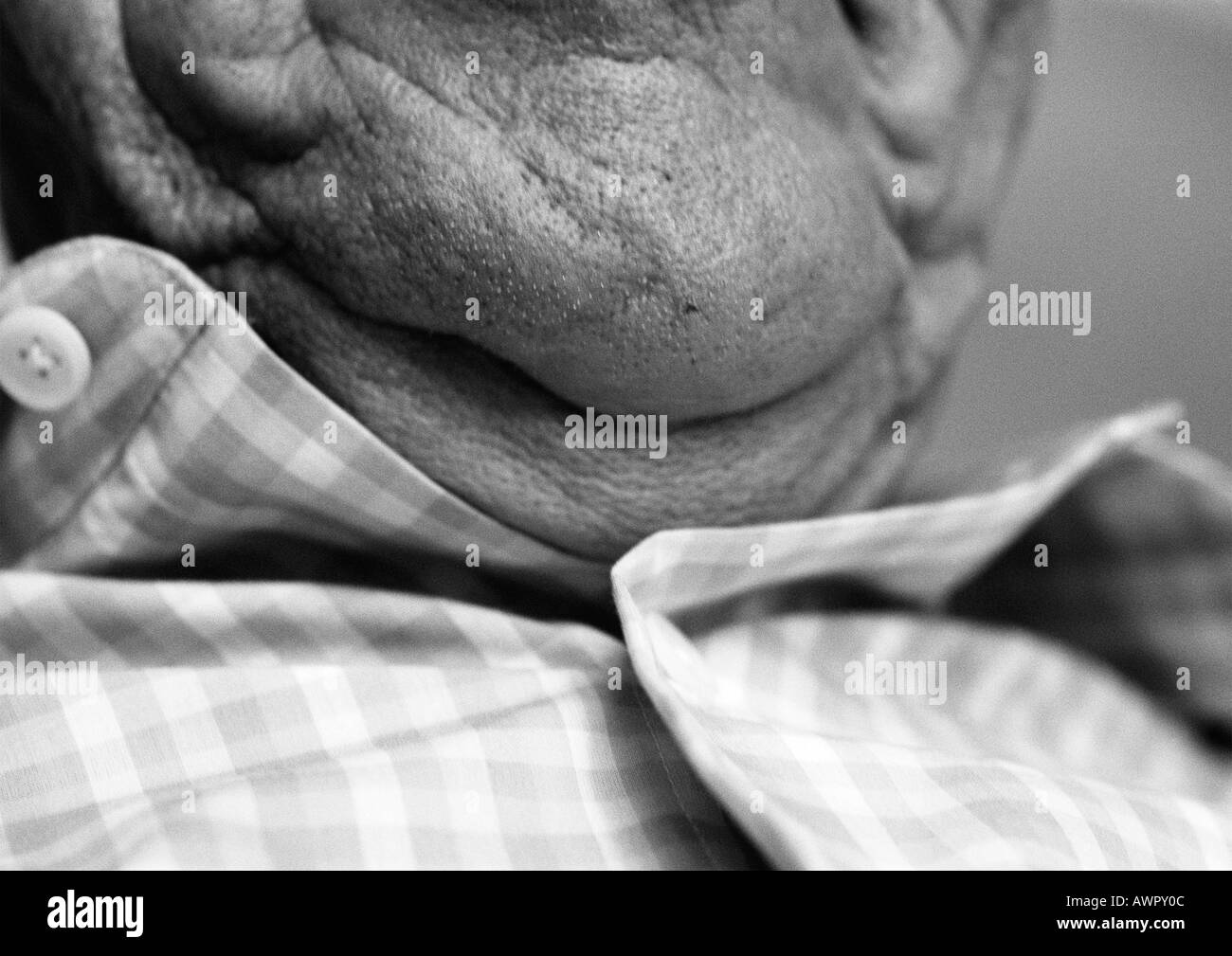 Senior man, close-up of chin, b&w. Stock Photo