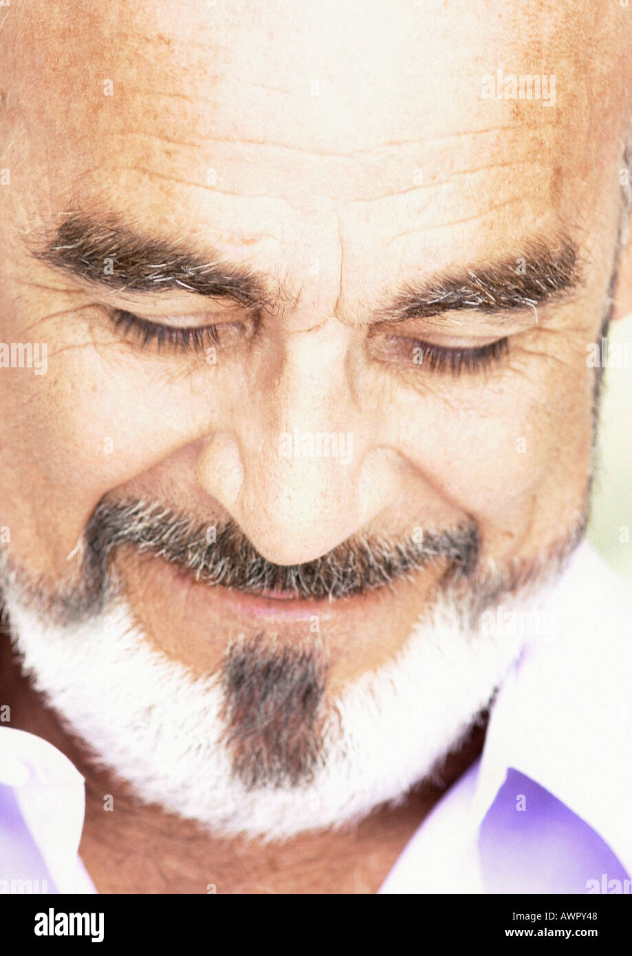 Mature man smiling, eyes closed, close-up. Stock Photo