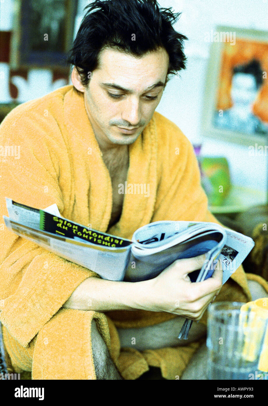 Man reading magazine, portrait. Stock Photo