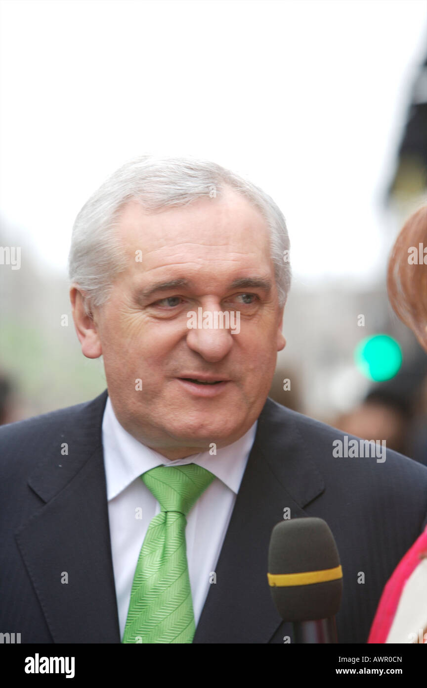 An Taoiseach (Prime Minister) Bertie Ahern talks to a reporter at the St Patrick's Day parade wearing a green tie Stock Photo