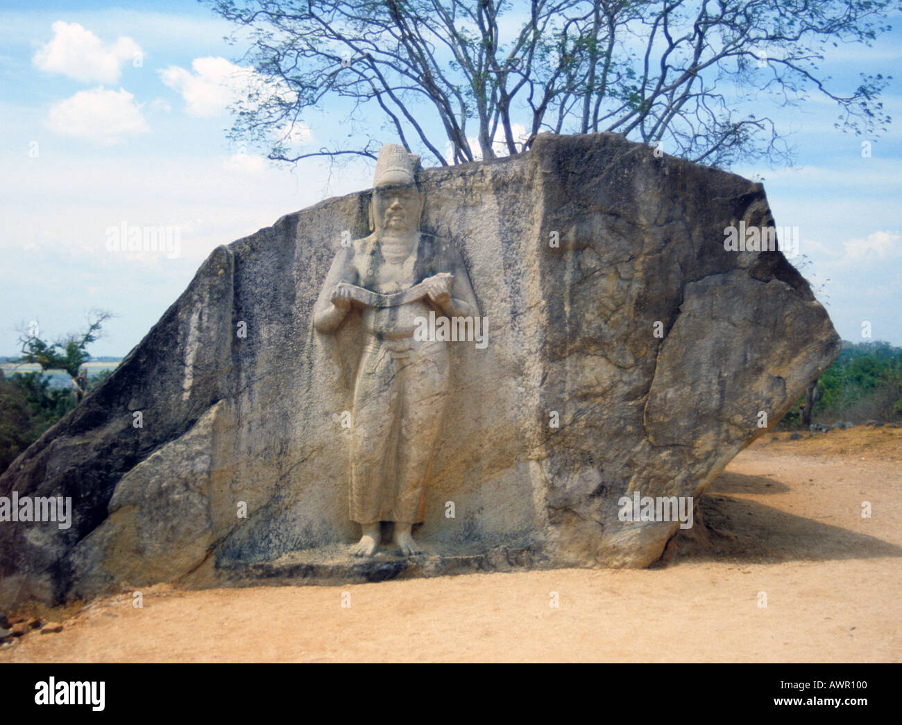 Statue of Sinhalese figure Sri Lanka South Asia carved from rock face