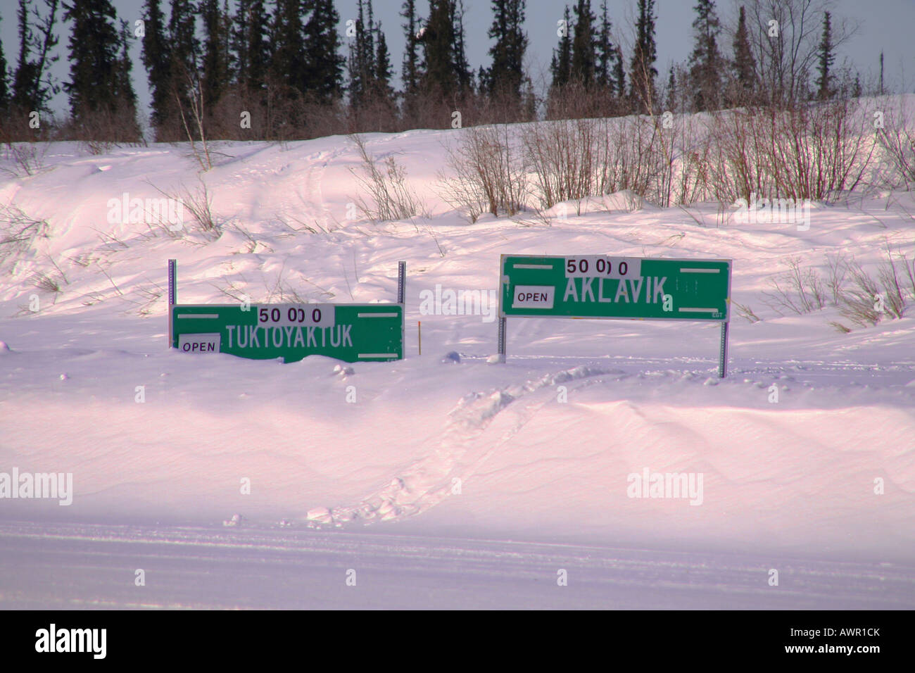 Signs for weight restrictions on the ice road between Tuktoyaktuk and
