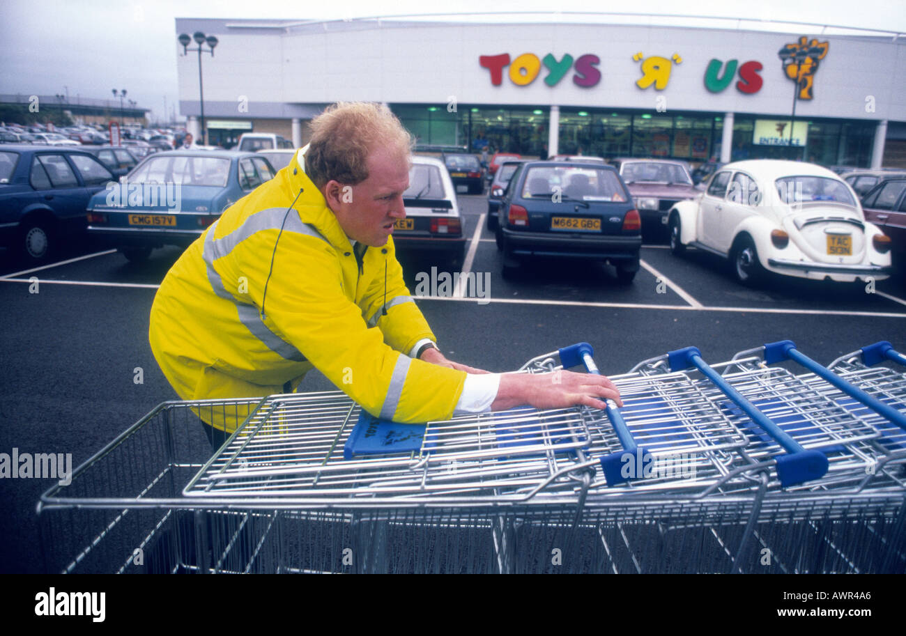 A man collects trollies at Toys R Us in Crosspoint Industrial Estate in