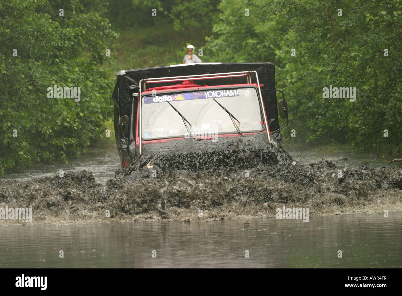 Rally Berlin-Breslau 2003, Unimog Truck driving through muddy water, Germany Stock Photo