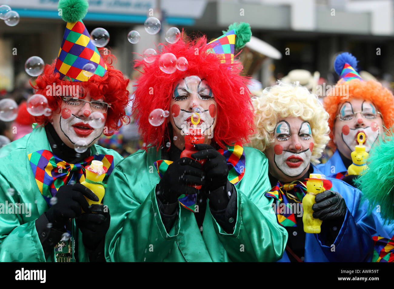 Mardi gras parade in Koblenz, Rhineland-Palatinate, Germany: clowns making soap-bubbles Stock Photo