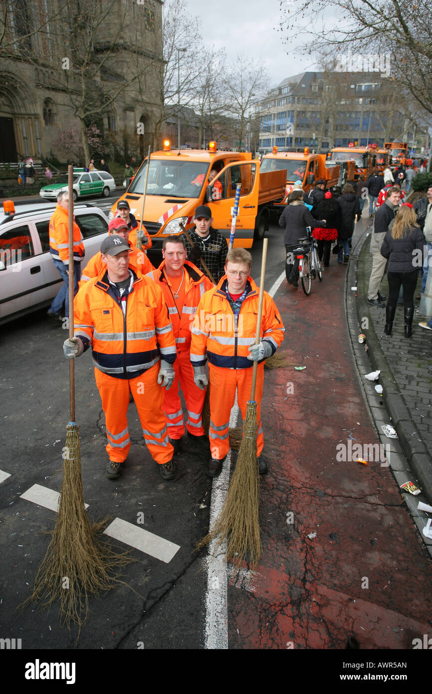 Mardi gras parade in Koblenz, Rhineland-Palatinate, Germany: dustmen during the street cleaning Stock Photo