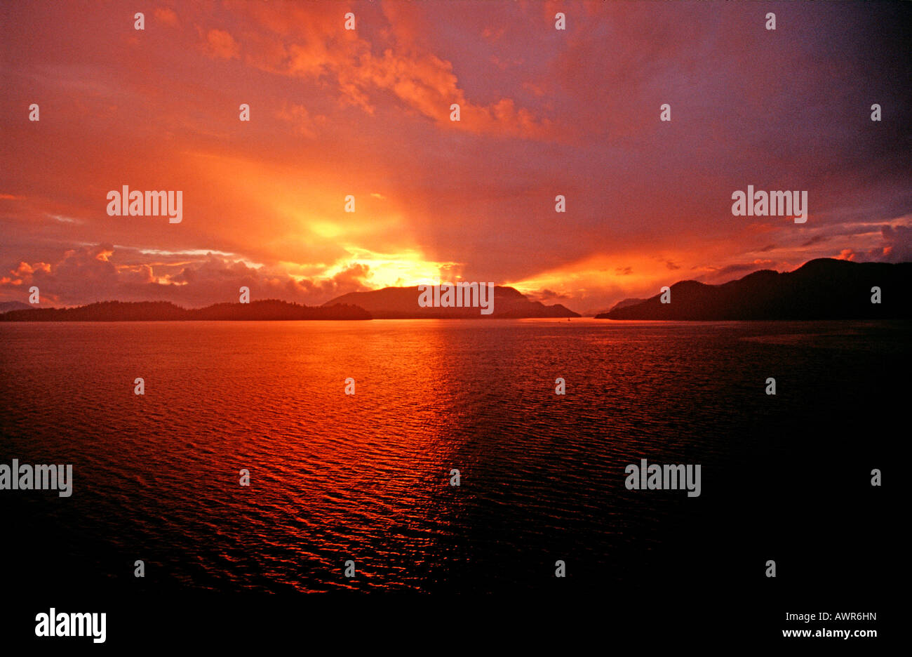 Sun setting over fjords, southeastern Alaska, USA Stock Photo