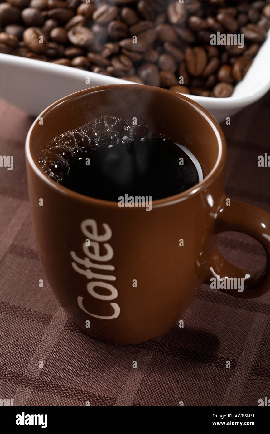 Cup of filter coffee and coffeebeans Stock Photo