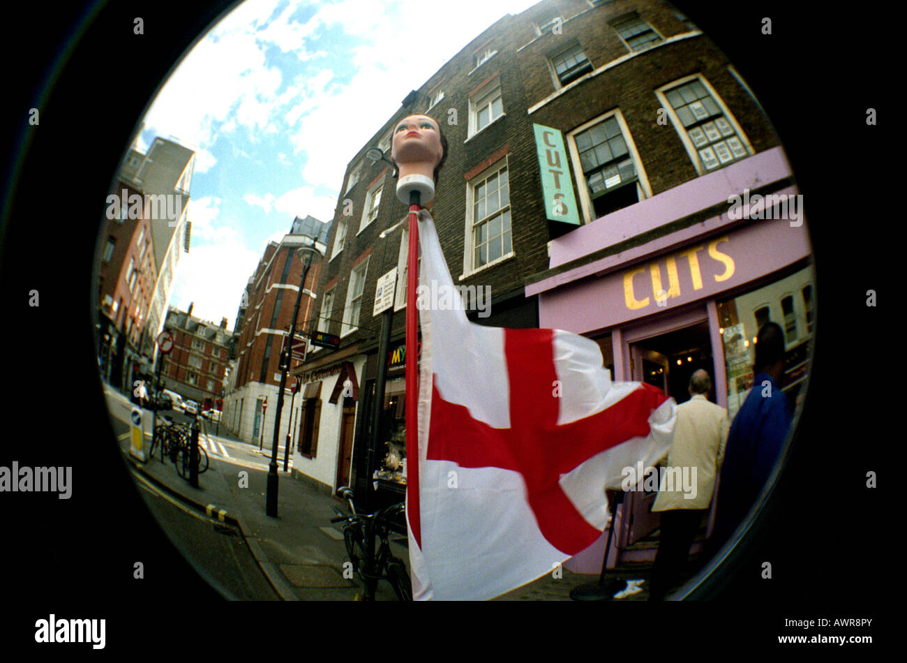 Fisheye view of England flag dummy's head on London street during
