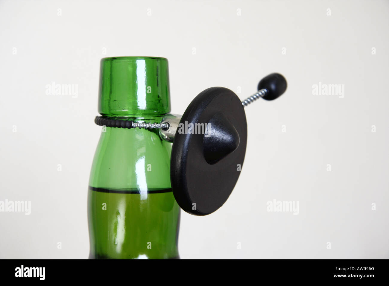 A security tag on a full whisky bottle Stock Photo Alamy