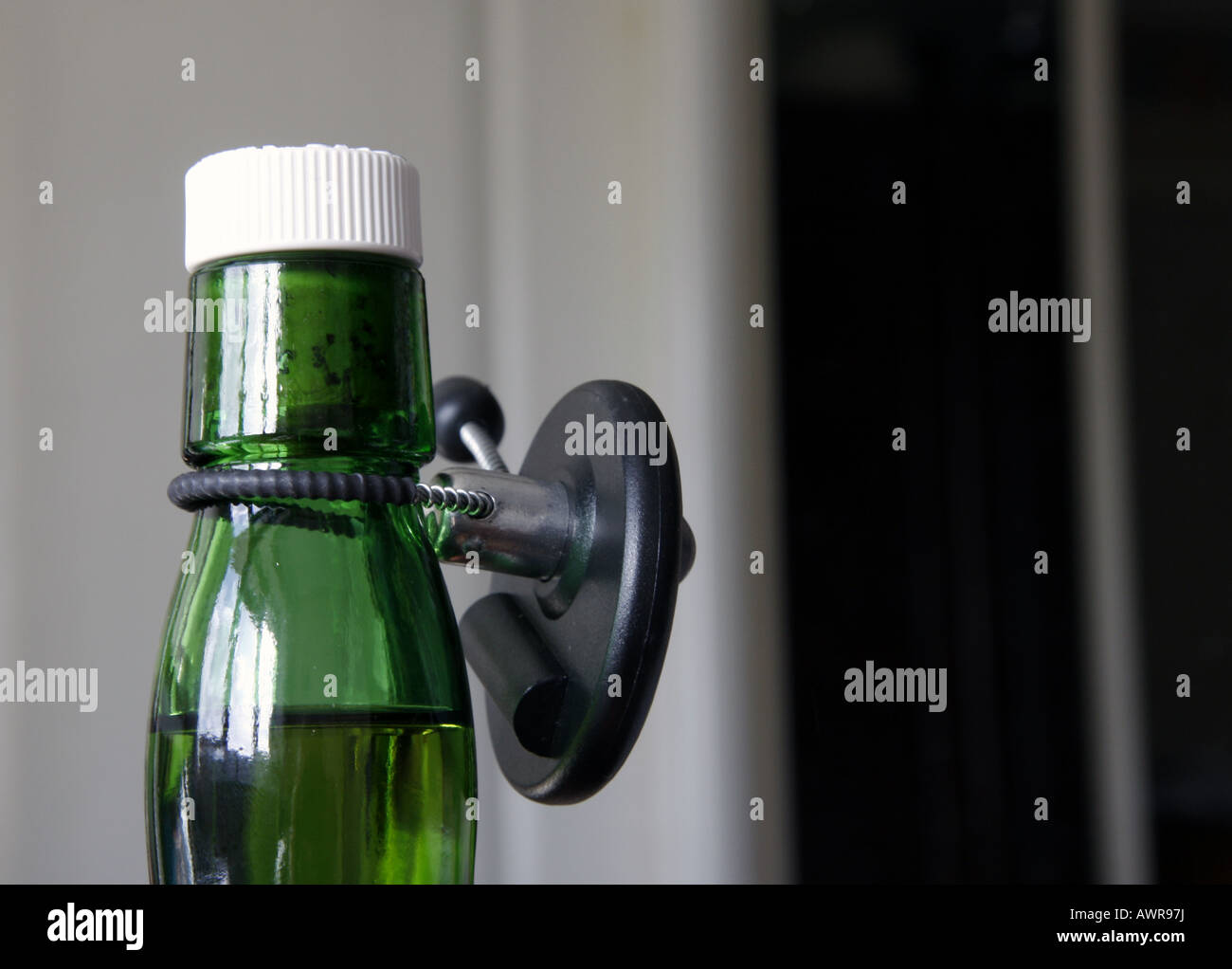 A security tag on a bottle of whisky Stock Photo Alamy
