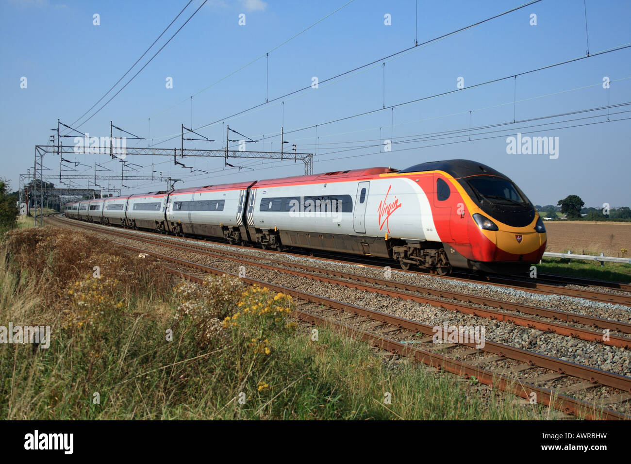 Virgin Trains class 390 Pendolino express train on London bound service on the West Coast Mainline Trent Valley in Warwickshire. Stock Photo