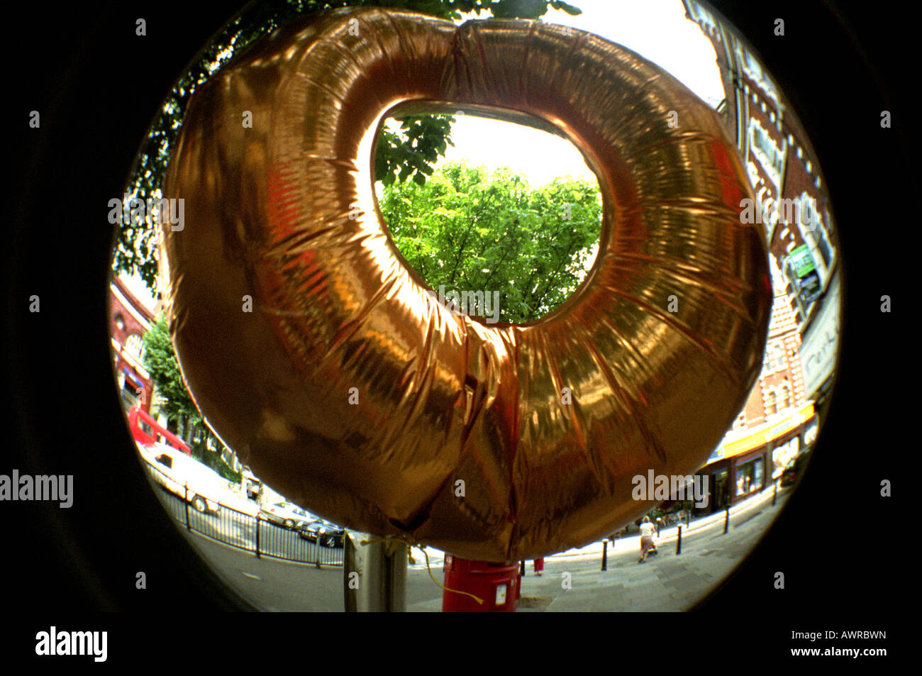 Giant inflatable doughnut on display in London high street Stock Photo