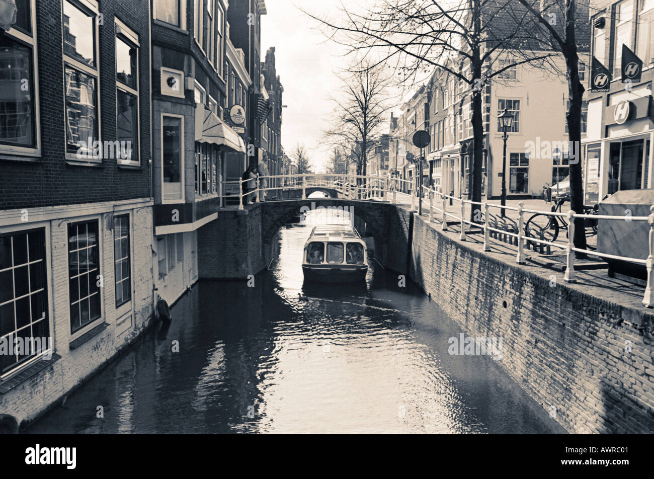 Barge on a canal in Amsterdam the Netherlands Europe - black and white photography Stock Photo