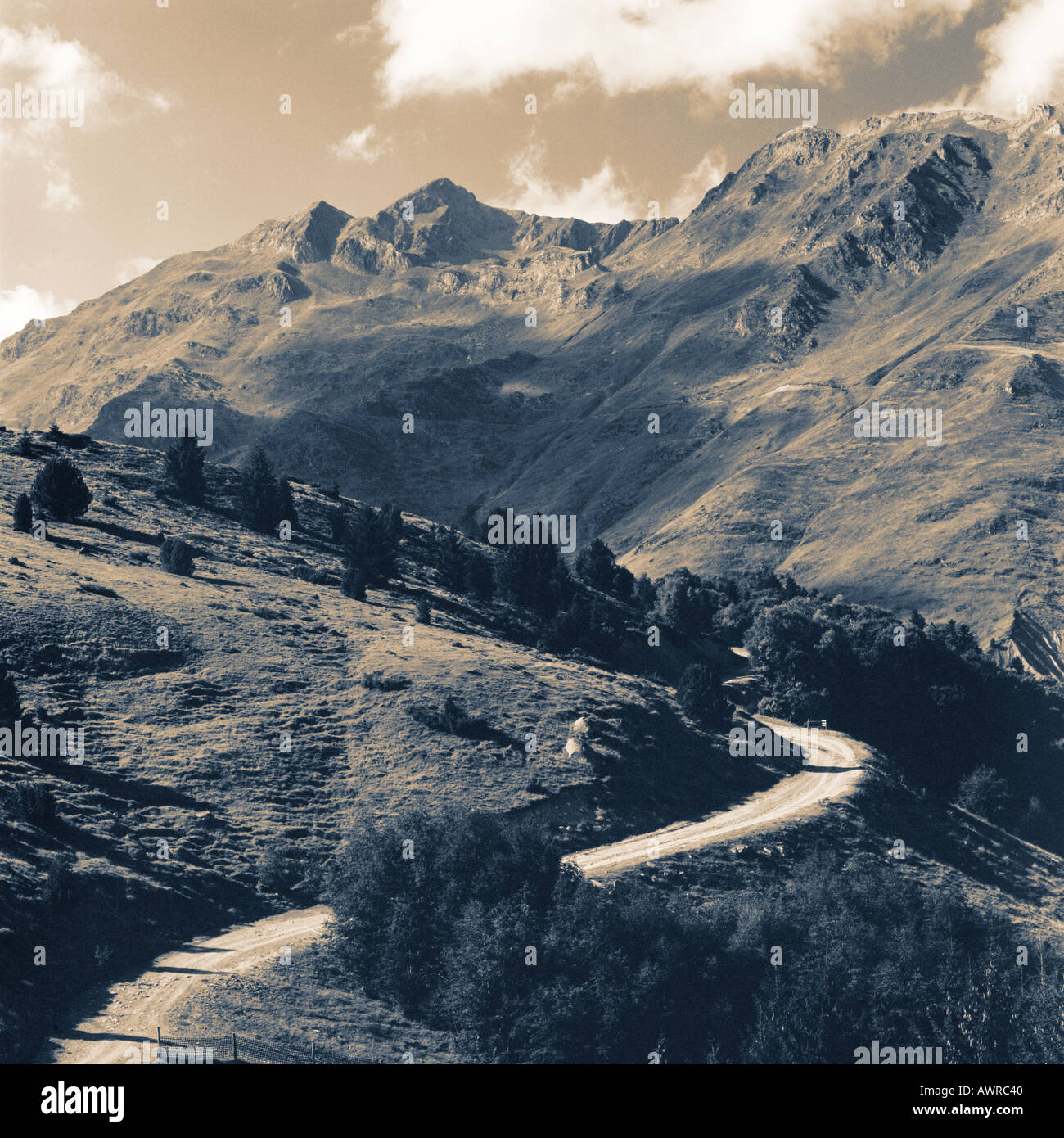 Black and white film photograph of the road up the Col du Tourmalet, Pyrenees France Europe Stock Photo