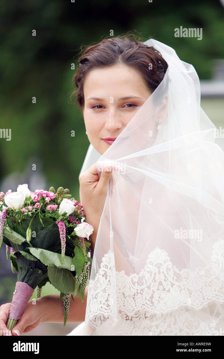 Smiling bride in traditional white wedding dress Stock Photo - Alamy