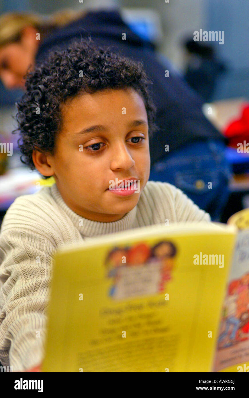 Black boy reads book at recreation center Model released Stock Photo