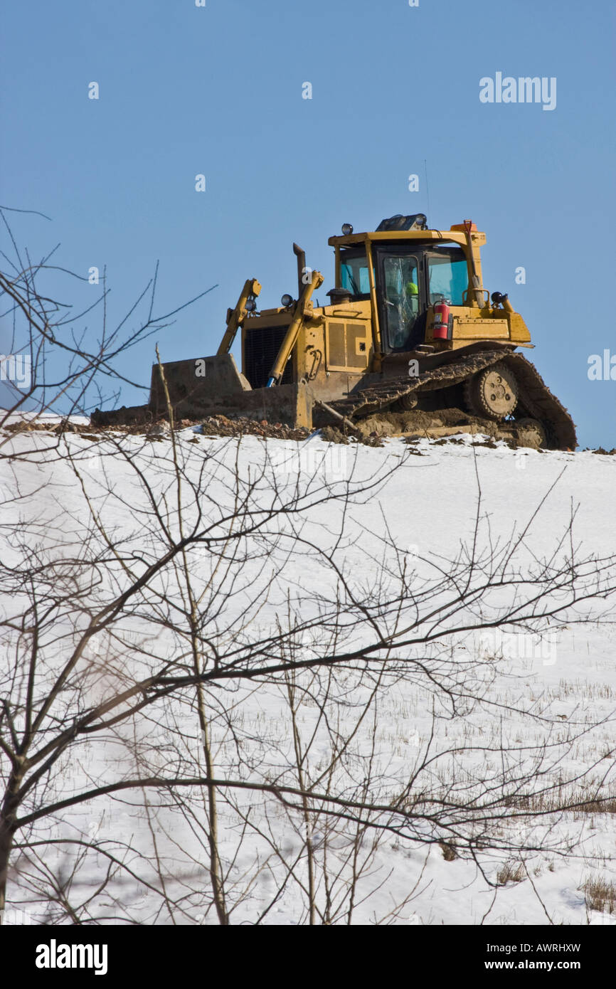 Bulldozer and dirt pile dump isolation no not people nobody low angle in USA Stock Photo