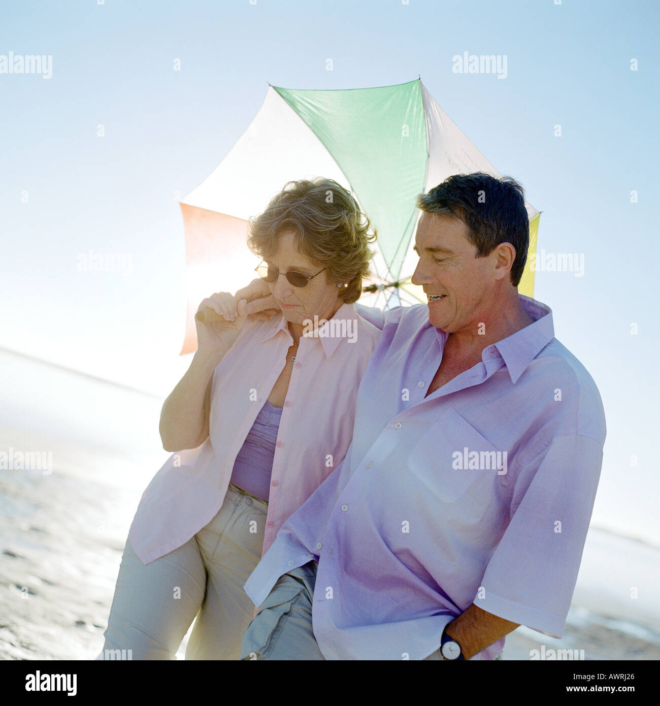 Mature couple walking with umbrella, portrait Stock Photo