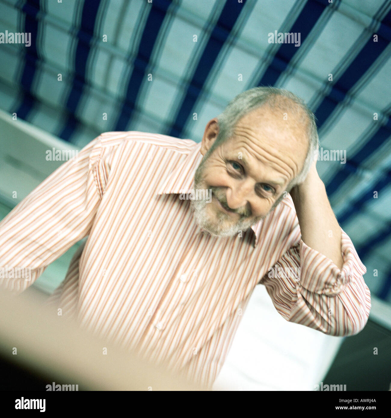 Mature man, hand behind head, portrait Stock Photo