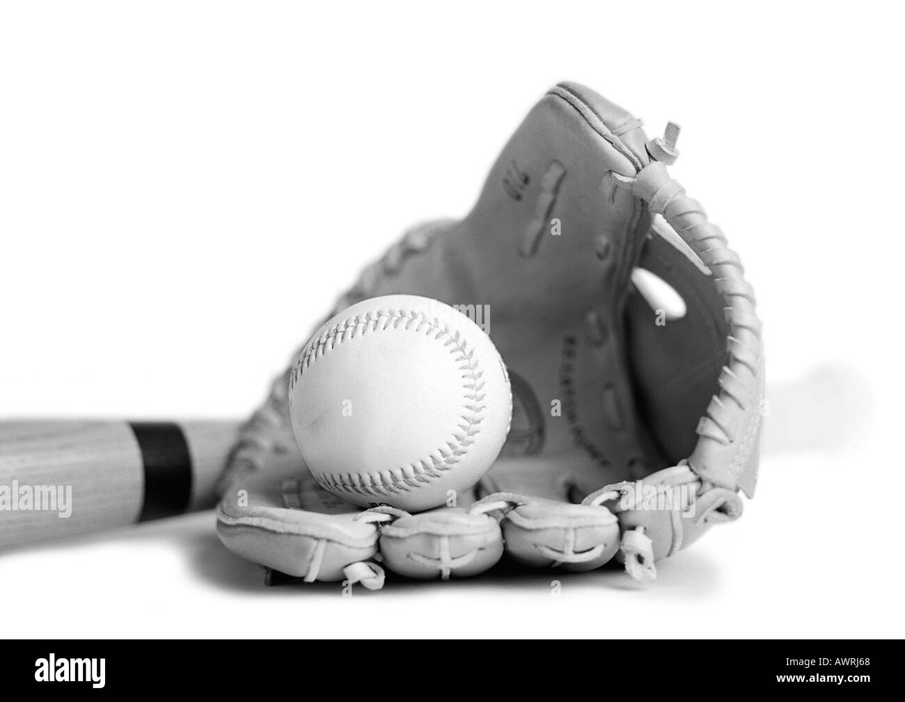 Baseball glove, ball and bat, close-up, b&w. Stock Photo