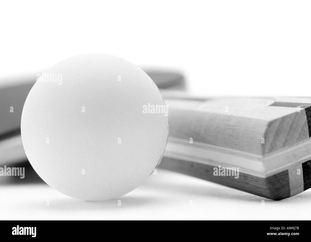 Ping pong paddle and ball, close-up, b&w. Stock Photo