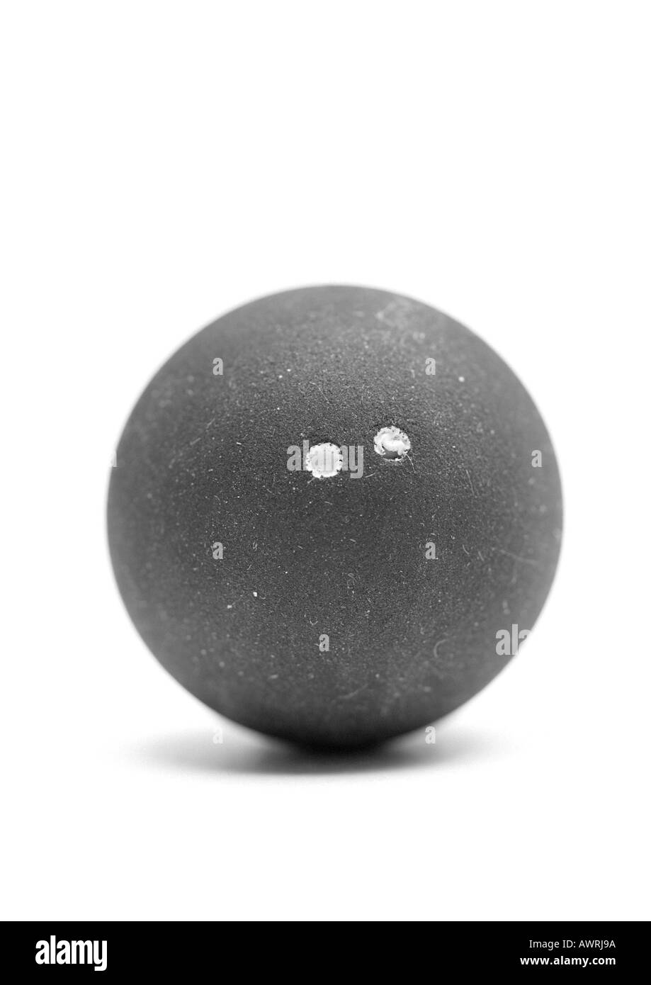 Squash ball, close-up, b&w. Stock Photo