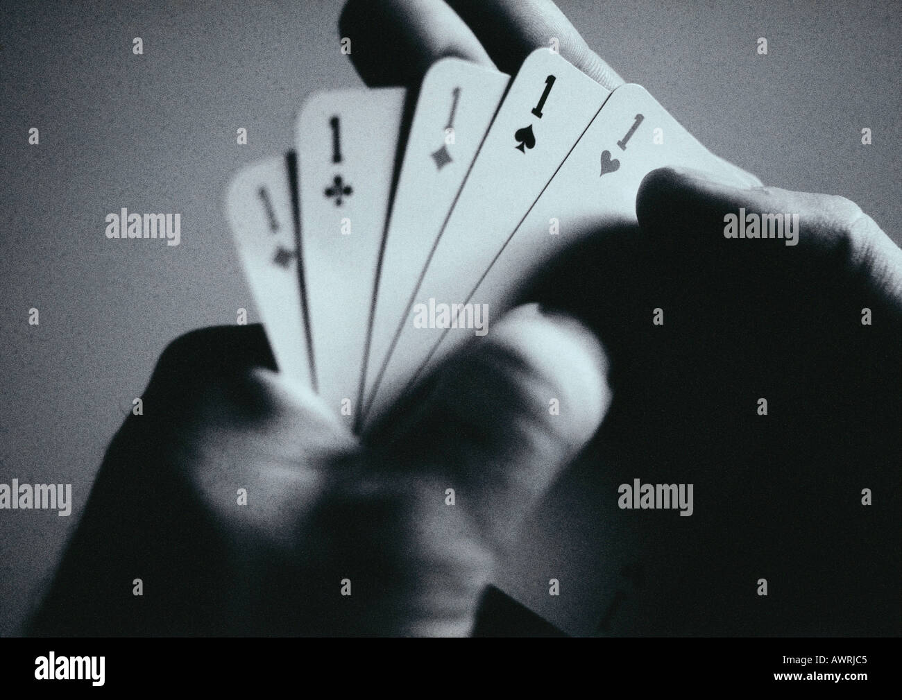 Hands holding playing cards, close-up Stock Photo